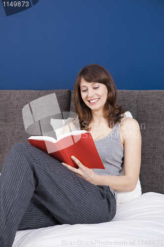 Image of Young girl reading a book