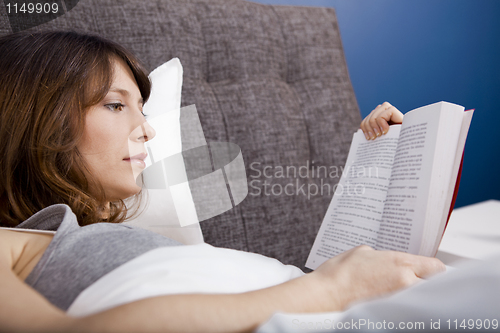 Image of Young girl reading a book