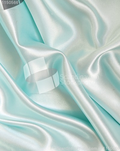 Image of Smooth elegant blue silk as background 