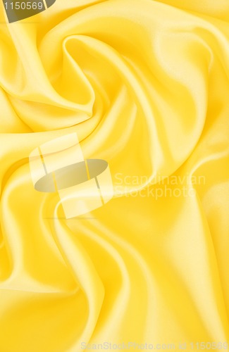 Image of Smooth elegant golden silk as background 