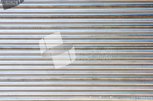 Image of worn metal garage door gate store roller shutter 