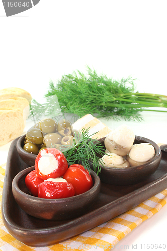 Image of olives, stuffed peppers and mushrooms