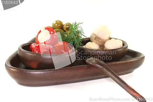 Image of olives, stuffed peppers and mushrooms