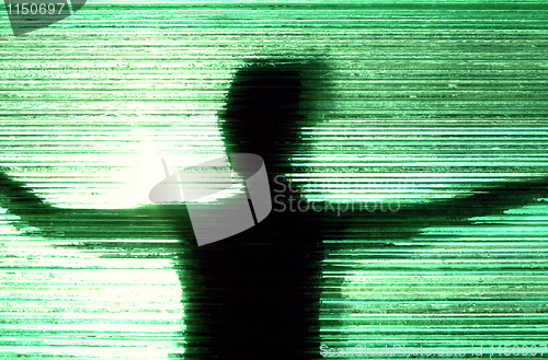 Image of Woman behind textured glass