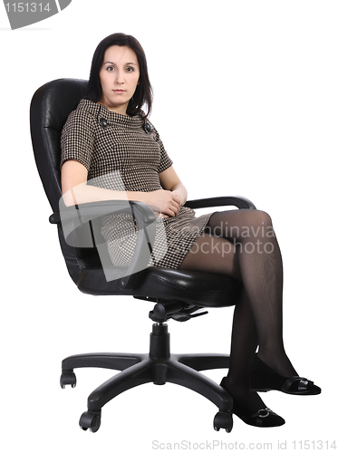 Image of Girl in brown dress in an office chair, isolated