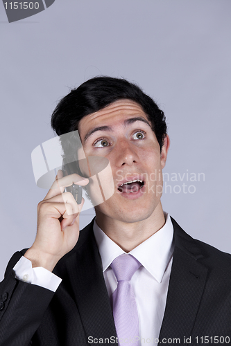 Image of Businessman talking on the cellular