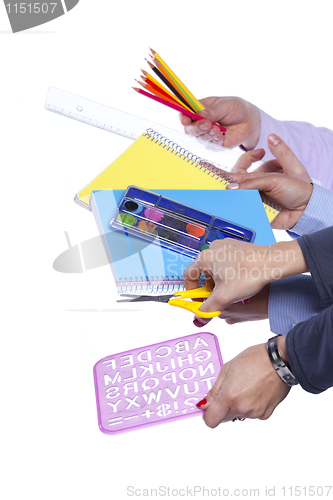 Image of Hands holding education objects