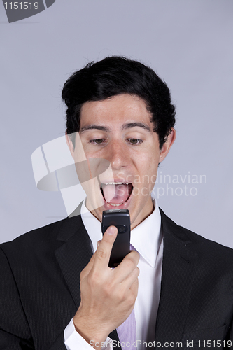 Image of Businessman talking on the cellular