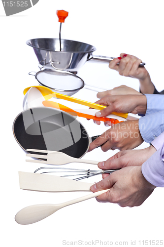 Image of Hands holding kitchenware tools