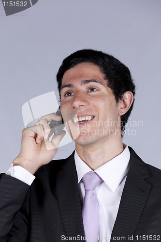 Image of Businessman talking on the cellular