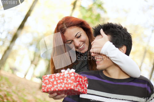 Image of young couple surprise