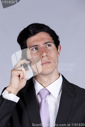 Image of Businessman talking on the cellular