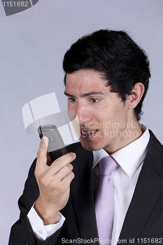 Image of Businessman talking on the cellular
