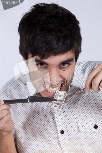 Image of Man eating little dollar banknote