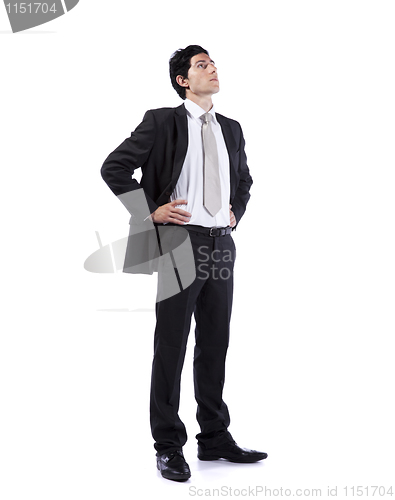 Image of Powerful businessman looking up