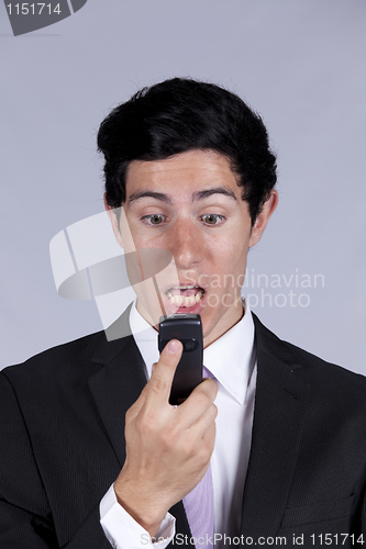 Image of Businessman talking on the cellular