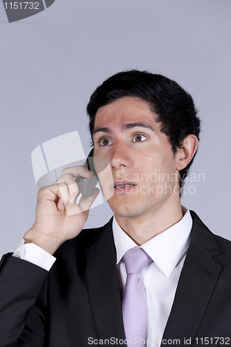 Image of Businessman talking on the cellular