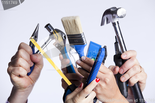 Image of Hands with tools