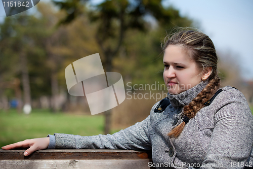 Image of The girl longs on the nature