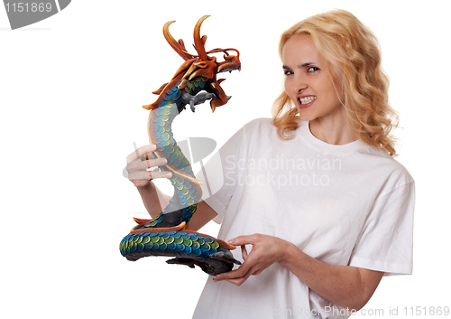 Image of beautiful girl with a wooden dragon