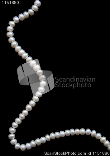 Image of White pearls on a black velvet 