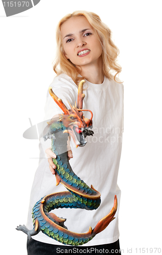 Image of beautiful girl with a wooden dragon