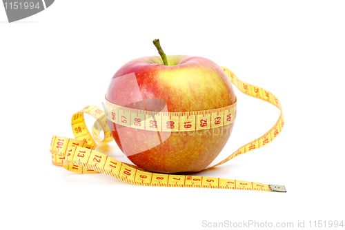 Image of Yellow-red apple and measurement tape