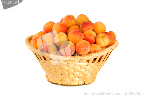 Image of Wicker basket filled with apricots