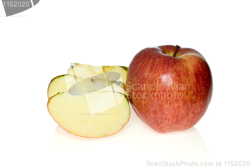 Image of One whole red apple and few slices