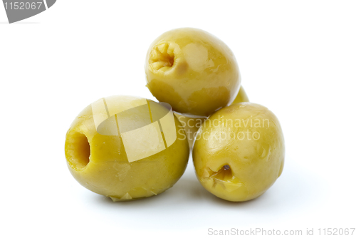 Image of Three pitted marinated green olives close-up