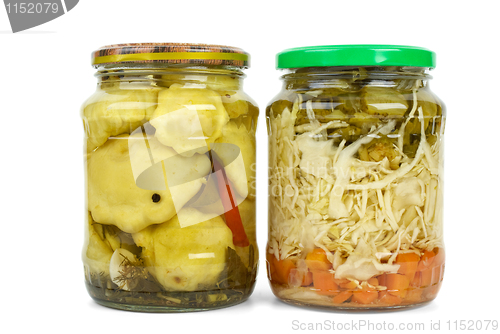 Image of Glass jars with marinated cymblings and vegetable assortment