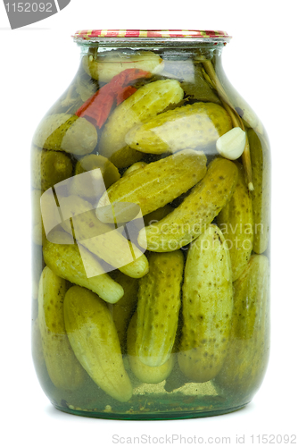 Image of Big glass jar with home-made marinated cucumbers