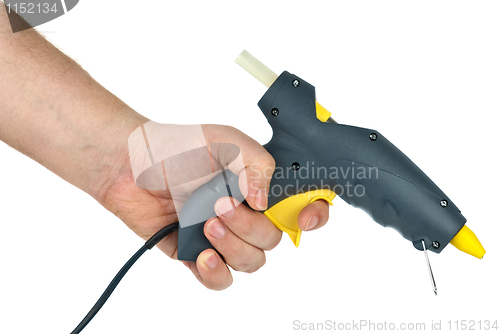 Image of Hand holding glue gun