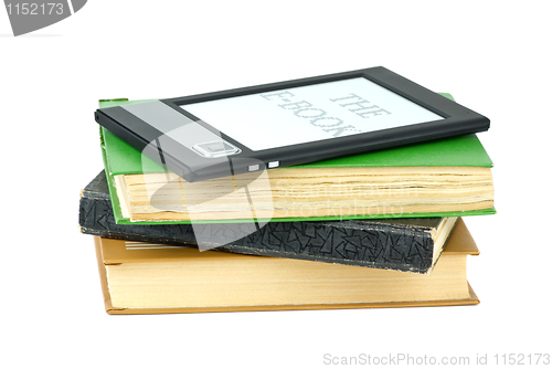Image of E-book reader and classic paper books