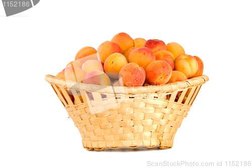 Image of Wicker basket filled with apricots