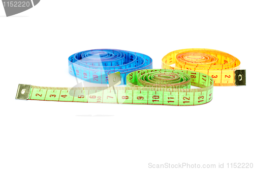 Image of Three rolled measuring tapes of different colors