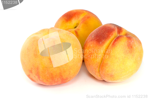 Image of Three orange peaches