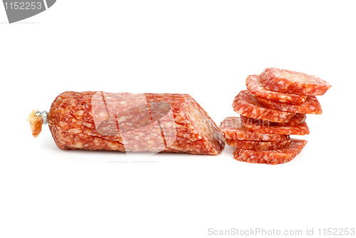 Image of Half of salami sausage and pile of slices near