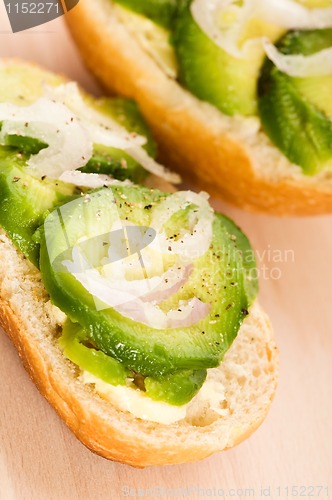 Image of Sandwich with avocado on a wooden board 
