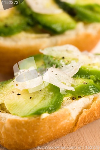 Image of Sandwich with avocado on a wooden board 