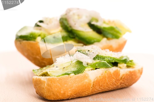 Image of Sandwich with avocado on a wooden board 