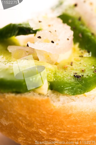 Image of Sandwich with avocado on a wooden board 