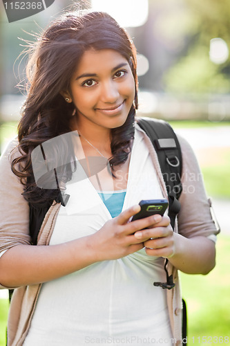 Image of Asian student texting 