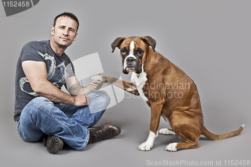 Image of handsome muscle man with his dog