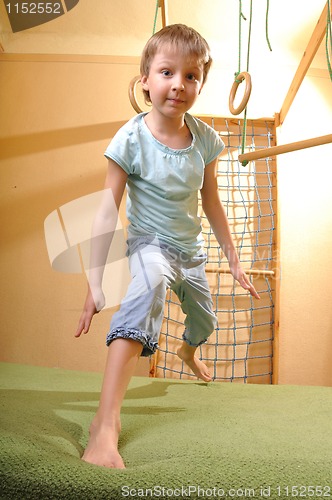 Image of child playing and exersicing at home