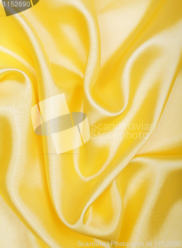 Image of Smooth elegant golden silk as background 