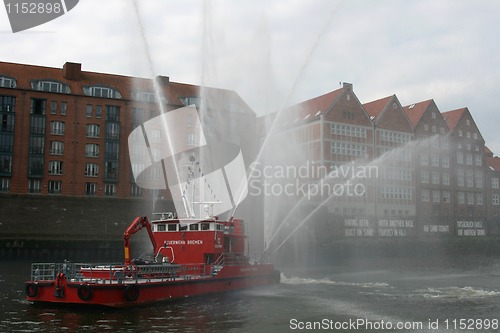 Image of Fireboat flush in the air.