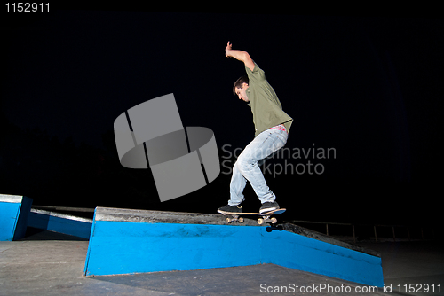 Image of Skateboarder on a slide