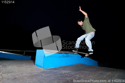 Image of Skateboarder on a slide