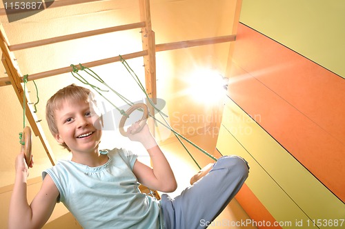 Image of child playing and exersicing at home